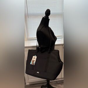 Dog Whisperer Pet Tote, a stylish and functional carrier designed for small dog